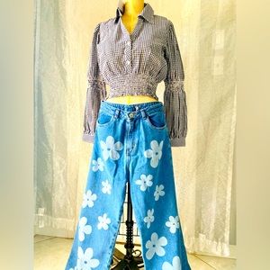 Mom light blue Jean pant with printed white flowers.